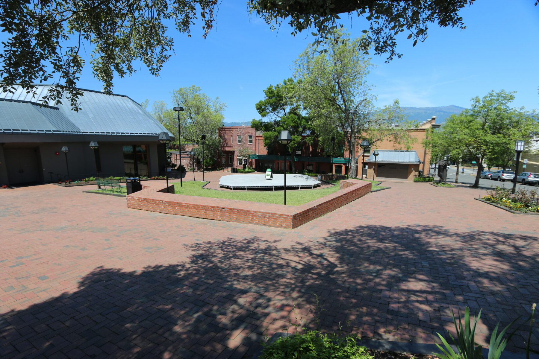 The brick plaza and theatre buildings of the Oregon Shakespeare Festival campus in Ashland, Oregon